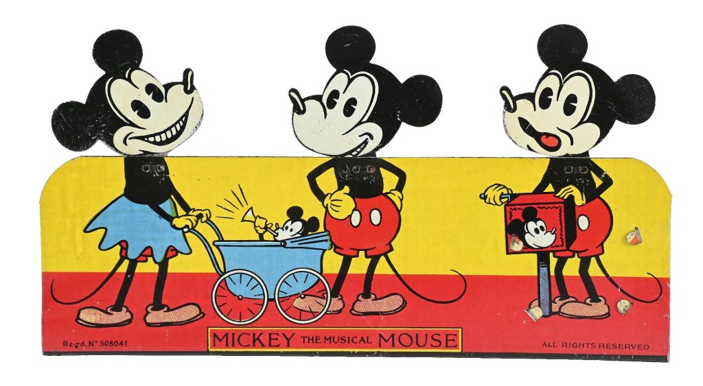 A vintage illustration of Mickey Mouse and Minnie Mouse characters, featuring Mickey in red shorts and black shirt, pushing a stroller with a smaller Mickey inside, and Minnie wearing a blue skirt and black top. The scene is set against a bright yellow and red background, labeled 'MICKEY THE MUSICAL MOUSE.'